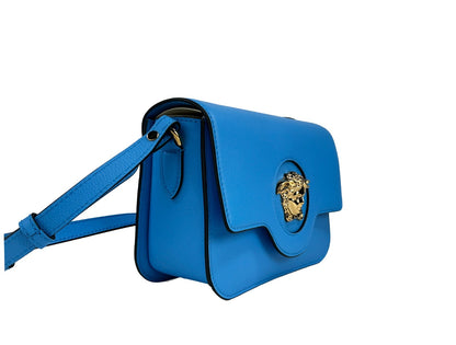 Small Crossbody Flap Handbag by Versace for women in leather blue & gold features a multifaceted silhouette, showcasing a secure flap & magnetic and multifaceted with versatile crossbody-strap, adjustable-strap & detachable-strap for multifaceted style.
