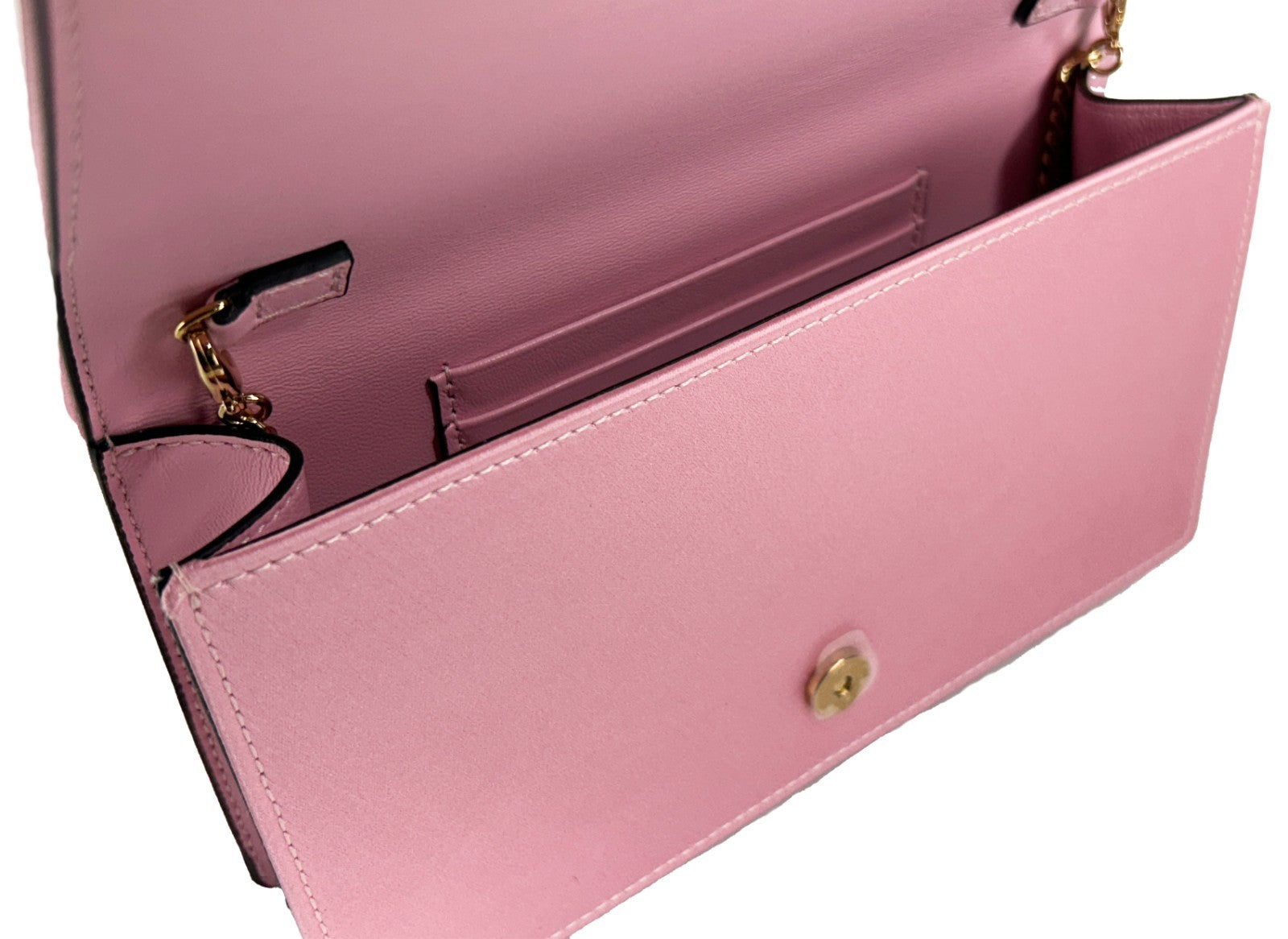 Mini Crossbody Flap Handbag by Versace for women in leather & crystal gold & pink features a multifaceted silhouette, showcasing a secure flap & magnetic and multifaceted with versatile crossbody-strap & detachable-strap for multifaceted style.