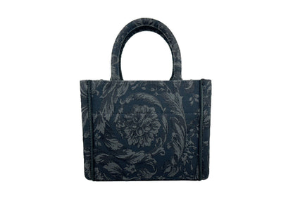 Small Travel Shopper Tote Handbag by Versace for women in calf & python leather black, gold & jacquard features an refined silhouette, showcasing a secure , ample , and versatile shoulder-strap, handle, adjustable-strap & detachable-strap for a sophisticated refined aesthetic.
