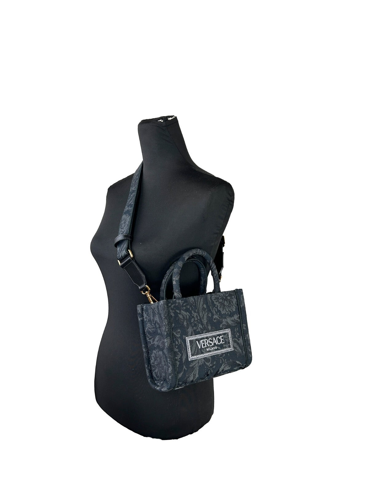 Small Travel Shopper Tote Handbag by Versace for women in calf & python leather black, gold & jacquard features a refined silhouette, showcasing a secure , organized , and versatile shoulder-strap, handle, adjustable-strap & detachable-strap for a refined finish.