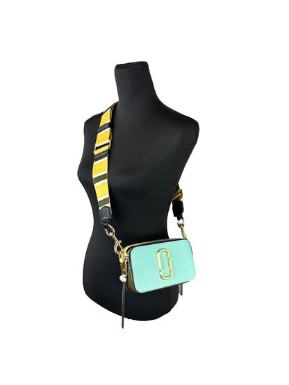 Small Crossbody Evening Handbag by Marc Jacobs for women in canvas gold & patterned features a multifaceted silhouette, showcasing a secure zipper and multifaceted with versatile crossbody-strap, adjustable-strap & detachable-strap for multifaceted style.