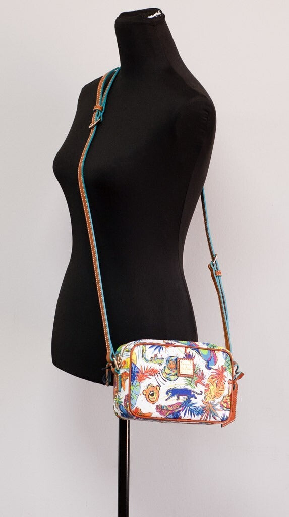 Small Crossbody Handbag by Dooney & Bourke for women in cotton polyester canvas blue & gold features a signature silhouette, showcasing a secure zipper and signature with versatile crossbody-strap, shoulder-strap & adjustable-strap for a sophisticated look.