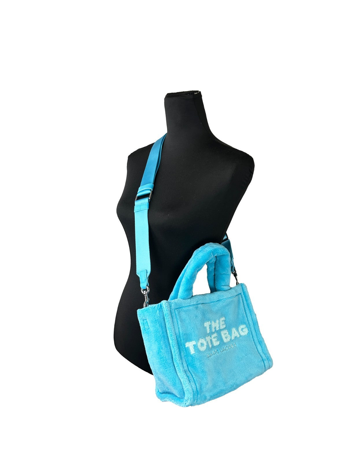 Small Crossbody Travel Tote Handbag by Marc Jacobs for women in synthetic fabric blue, silver & signature features a transformative elegance silhouette, showcasing a secure zipper, organized , and versatile crossbody-strap & handle for a transformative elegance look.