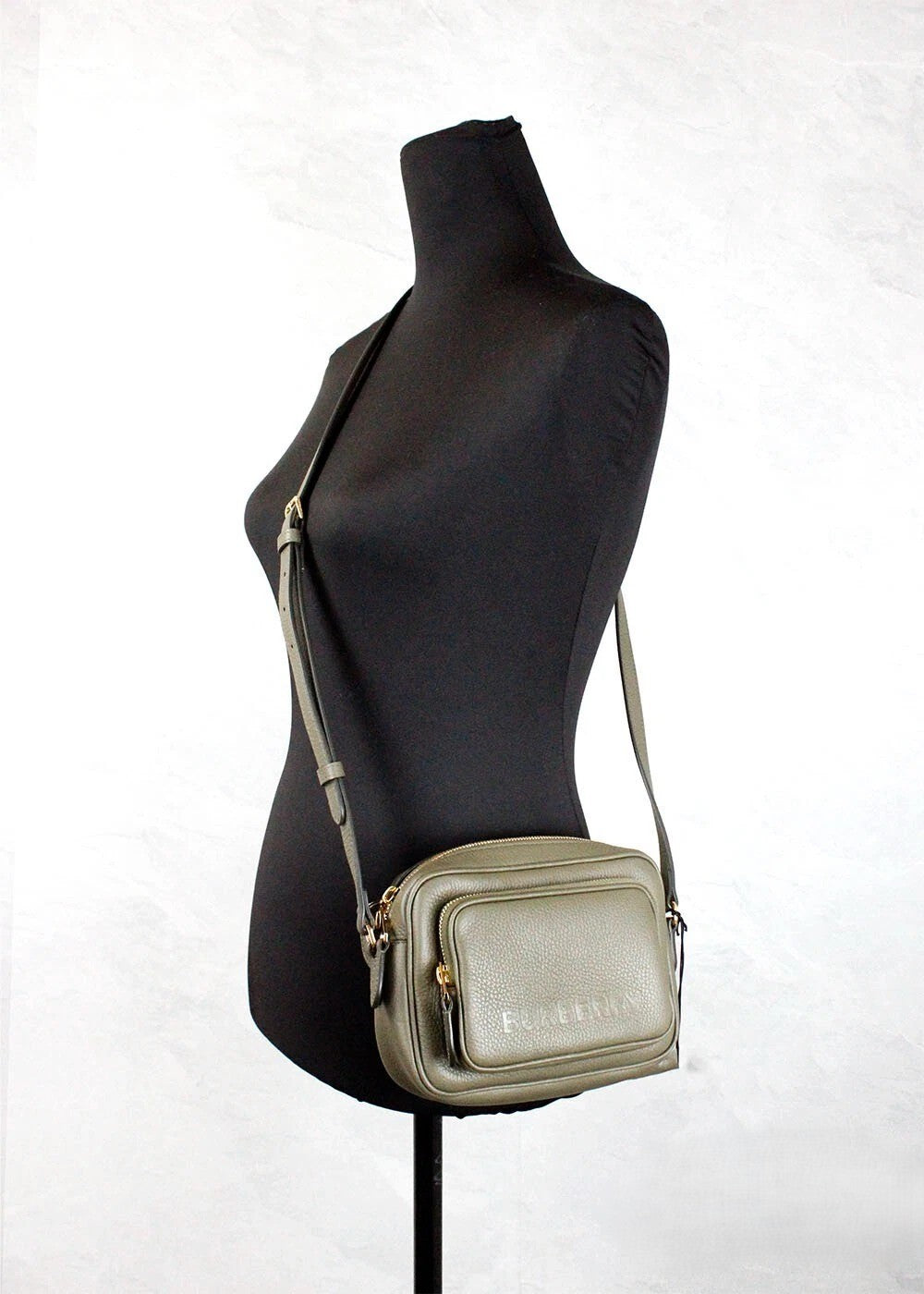 Small Crossbody Camera Handbag by Burberry for women in nylon & leather gold & green features an multi-faceted design with a secure zipper, ample , and versatile crossbody-strap & adjustable-strap for a multi-faceted finish.
