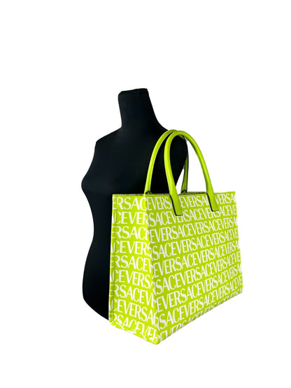 Large Travel Tote Bag by Versace for women in cotton polyester canvas gold, green & patterned features a jet-set sophisticated Medusa Cotton Polyester Canvas Large Travel Tote Bag design with a secure , ample cardholder, and versatile handle for a jet-set sophisticated finish.