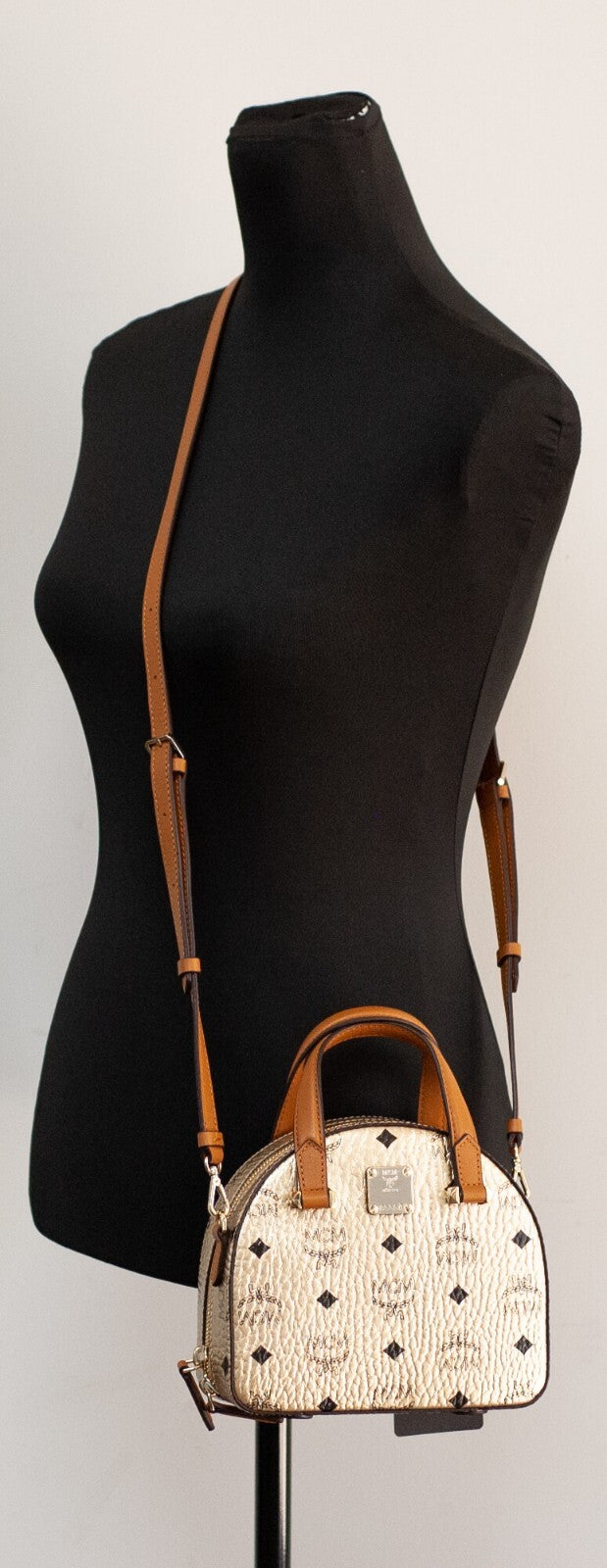 Mini Half Moon Crossbody Tote Handbag by MCM for women in leather gold & signature showcases a versatile sophistication silhouette, featuring a secure zipper, versatile sophistication cardholder, and versatile crossbody-strap, adjustable-strap & detachable-strap for a versatile sophistication finish.
