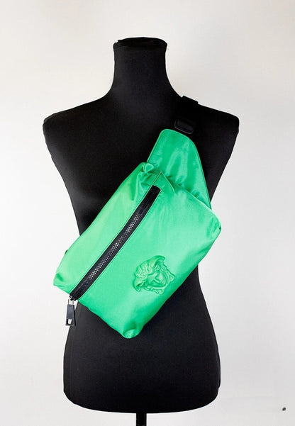 Small Travel Crossbody Fanny Pack Belt Bag by Versace for women in nylon black & green features a jet-setting Medusa Nylon Small Travel Crossbody Fanny Pack Belt Bag design with a secure zipper, jet-setting , and versatile crossbody-strap, adjustable-strap & belt-strap for a jet-setting look.