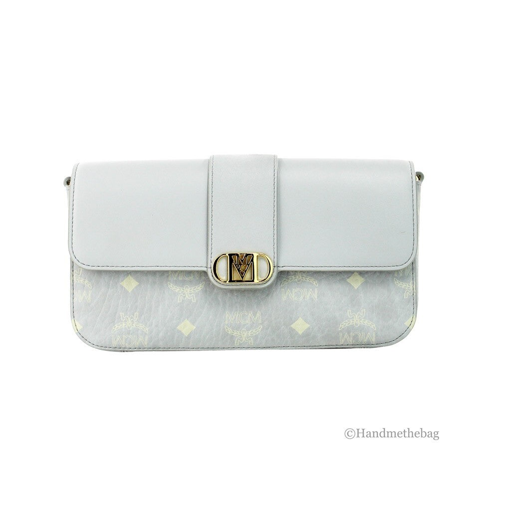 Small Crossbody Clutch Handbag by MCM for women in pebbled leather gold showcases a sculptural silhouette, featuring a secure zipper, ample cardholder, and versatile crossbody-strap, adjustable-strap & detachable-strap for a sculptural finish.