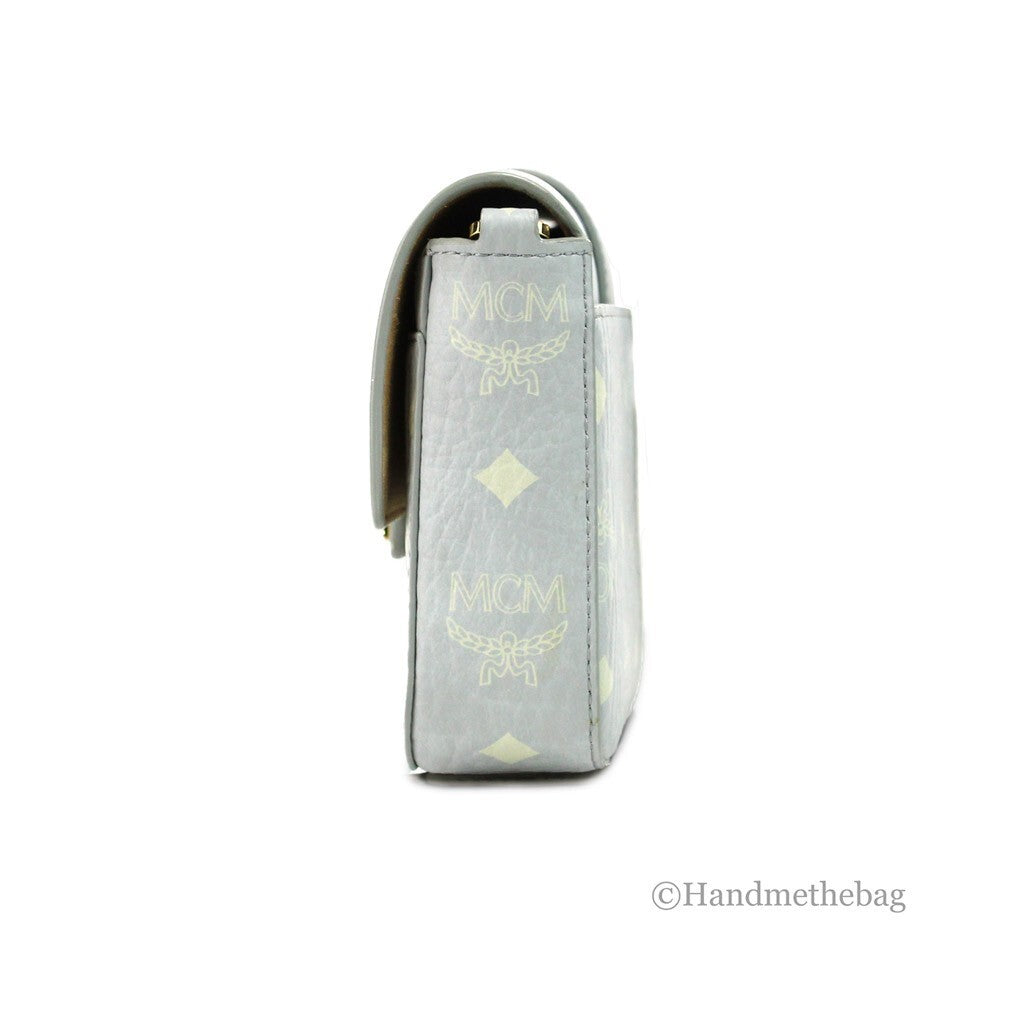 Small Crossbody Clutch Handbag by MCM for women in pebbled leather gold features a sculptural silhouette with a secure zipper, organized cardholder, and versatile crossbody-strap, adjustable-strap & detachable-strap for a sculptural finish.