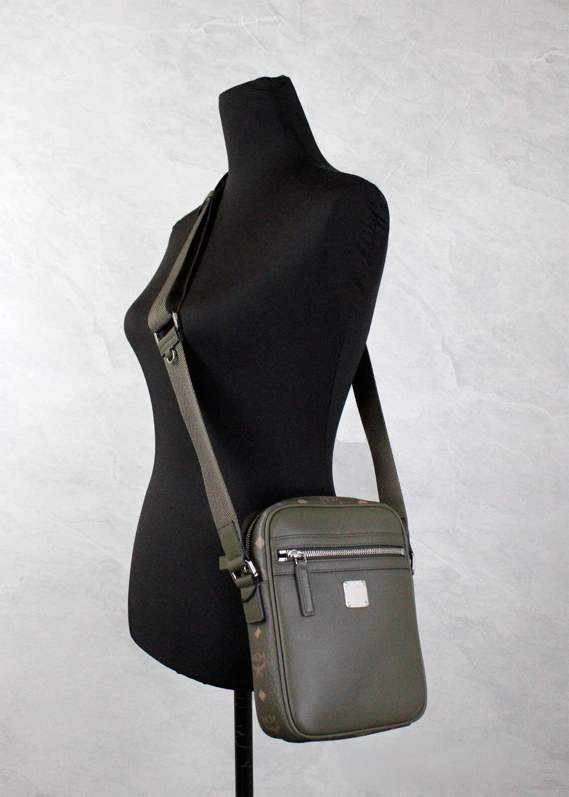 Small Crossbody Camera Handbag by MCM for women in leather green, silver & patterned showcases a versatile sophistication silhouette, featuring a secure zipper, versatile sophistication , and versatile crossbody-strap & adjustable-strap for a versatile sophistication finish.