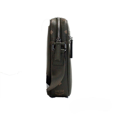 Small Crossbody Camera Handbag by MCM for women in leather green, silver & patterned features a transformative sophistication silhouette, showcasing a secure zipper, ample , and versatile crossbody-strap & adjustable-strap for a transformative sophistication look.