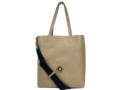 This Large Pouch Tote Bag by Versace for women in faux patent leather gold features an jet-set Medusa Faux Patent Leather Large Pouch Tote Bag design with a secure , ample coin-purse, and jet-set detachable-strap & handle.