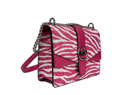 Small Crossbody Flap Handbag by Michael Kors for women in pvc pink, silver, patterned & signature features an versatile silhouette, showcasing a secure flap & magnetic and versatile with versatile crossbody-strap for a versatile finish.