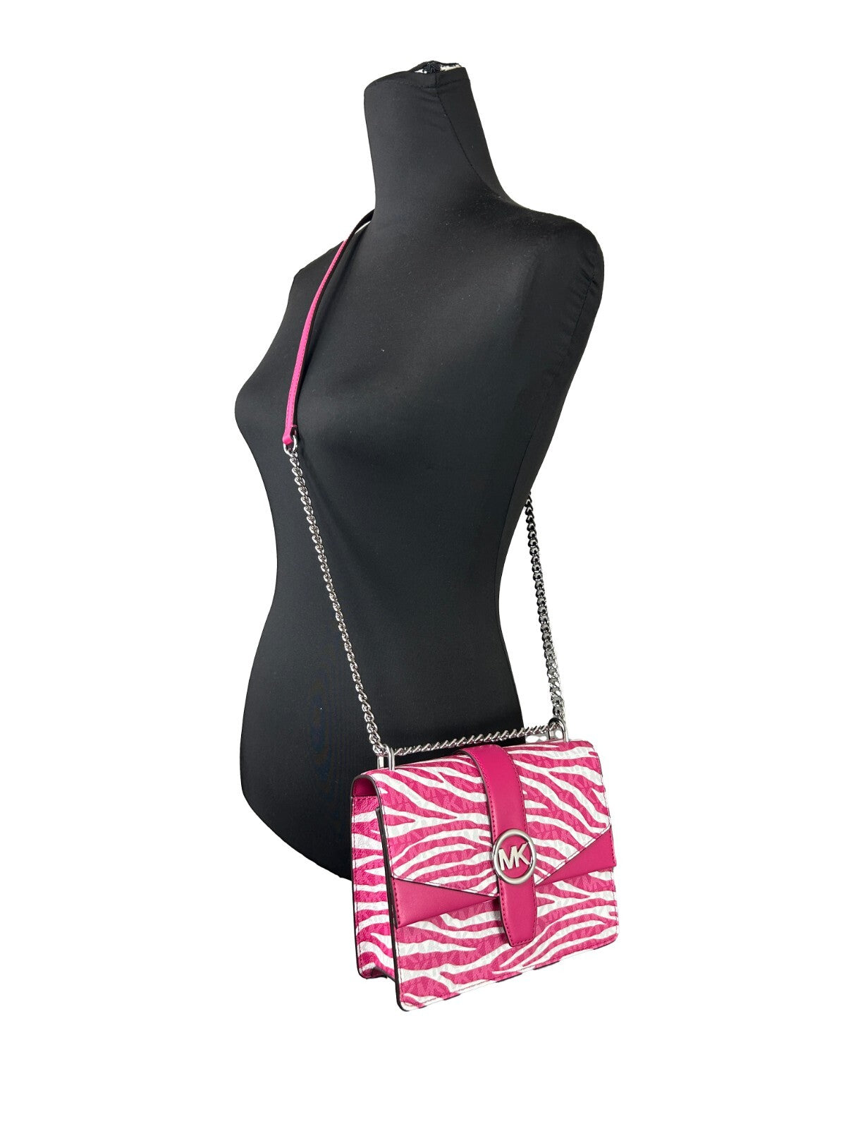 Small Crossbody Flap Handbag by Michael Kors for women in pvc pink, silver, patterned & signature features a versatile chic silhouette, meticulously detailed with a secure flap & magnetic, ample , and versatile crossbody-strap.