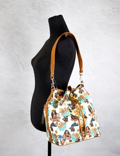 Medium Crossbody Bucket Handbag by Dooney & Bourke for women in cotton polyester canvas brown, gold & print features an multi-faceted design with a secure zipper & drawstring, ample , and versatile crossbody-strap, shoulder-strap, handle, adjustable-strap & detachable-strap for a multi-faceted finish.