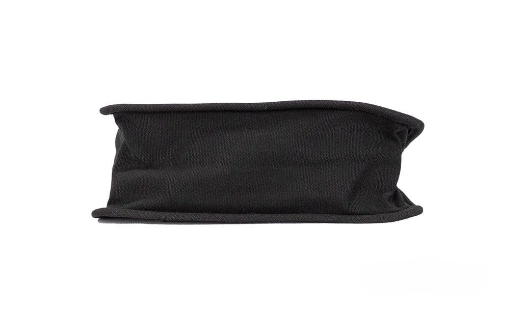 Medium Travel Tote Shoulder Bag by Marc Jacobs for women in canvas black & silver showcases a statuesque silhouette, artfully detailed with a secure zipper, organized , and versatile handle for a statuesque look.