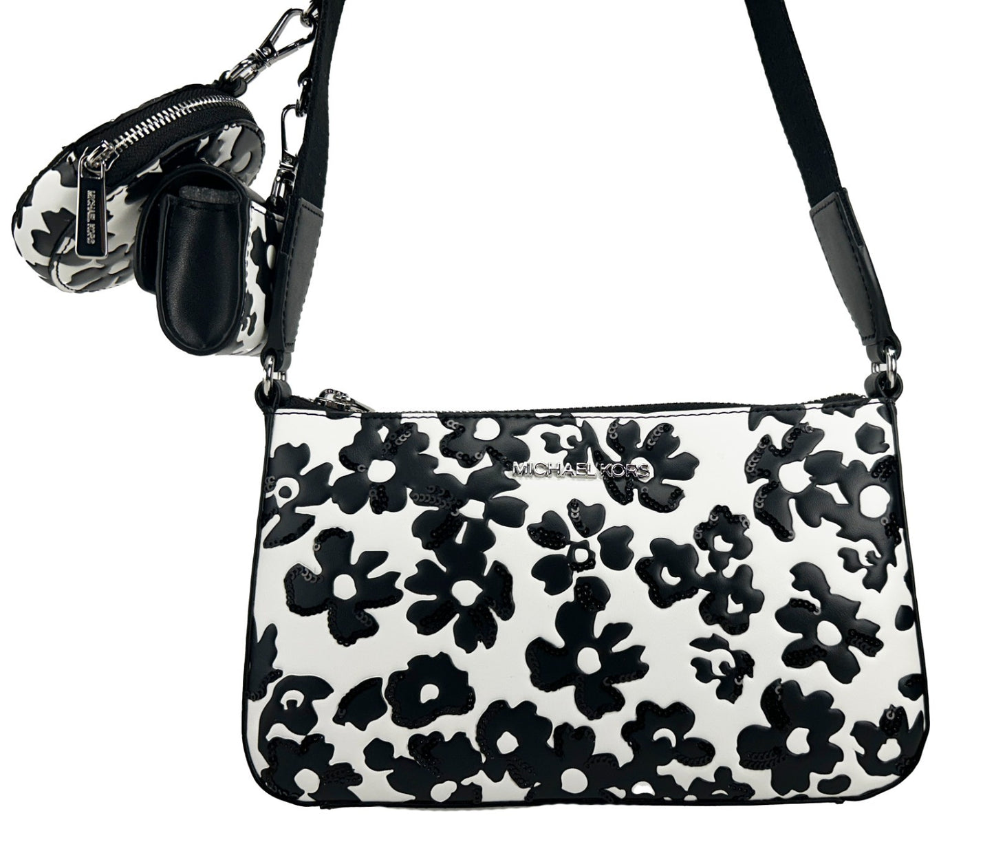 Small Crossbody Travel Pouch Handbag by Michael Kors for women in leather black, silver, patterned & floral features a signature silhouette, showcasing a secure zipper and signature cardholder & coin-purse with versatile crossbody-strap, adjustable-strap & detachable-strap for a sophisticated look.