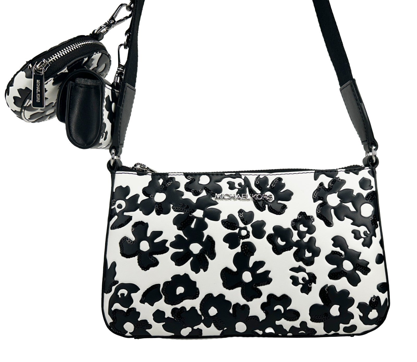 Small Crossbody Travel Pouch Handbag by Michael Kors for women in leather black, silver, patterned & floral features a signature silhouette, showcasing a secure zipper and signature cardholder & coin-purse with versatile crossbody-strap, adjustable-strap & detachable-strap for a sophisticated look.