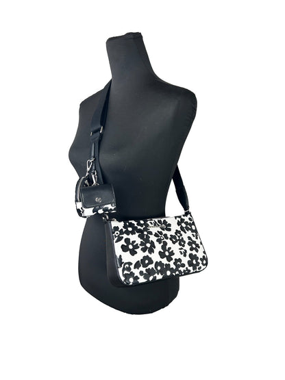 Small Crossbody Travel Pouch Handbag by Michael Kors for women in leather black, silver, patterned & floral features a exquisite silhouette, showcasing a secure zipper and exquisite cardholder & coin-purse with versatile crossbody-strap, adjustable-strap & detachable-strap for a exquisite finish.