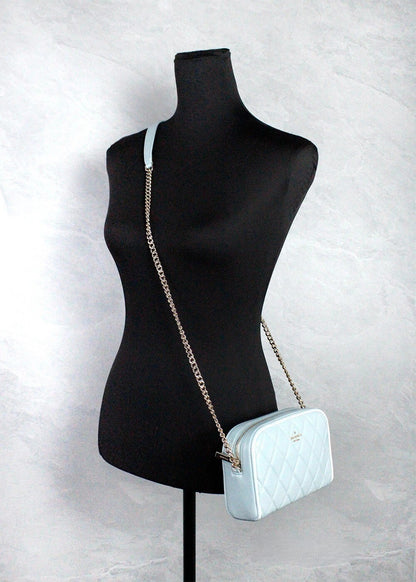 Mini Quilted Crossbody Camera Handbag by Kate Spade for women in leather gold, patterned & argyle showcases a versatile sophistication silhouette, featuring a secure zipper, versatile sophistication , and versatile crossbody-strap & adjustable-strap for a versatile sophistication finish.