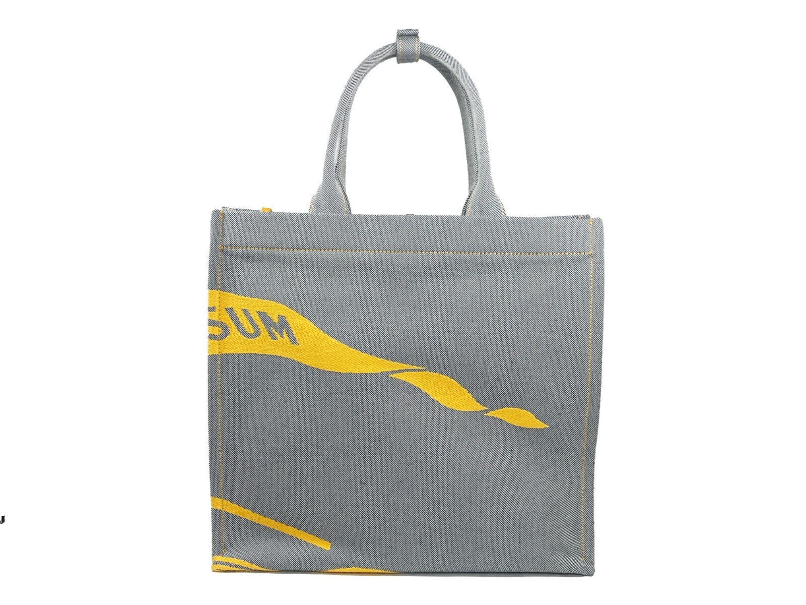 This Pouch Tote Handbag by Burberry for women in faux leather & canvas and gray, silver & patterned presents a sculptural silhouette featuring a secure , ample coin-purse, and versatile handle for a sculptural finish.