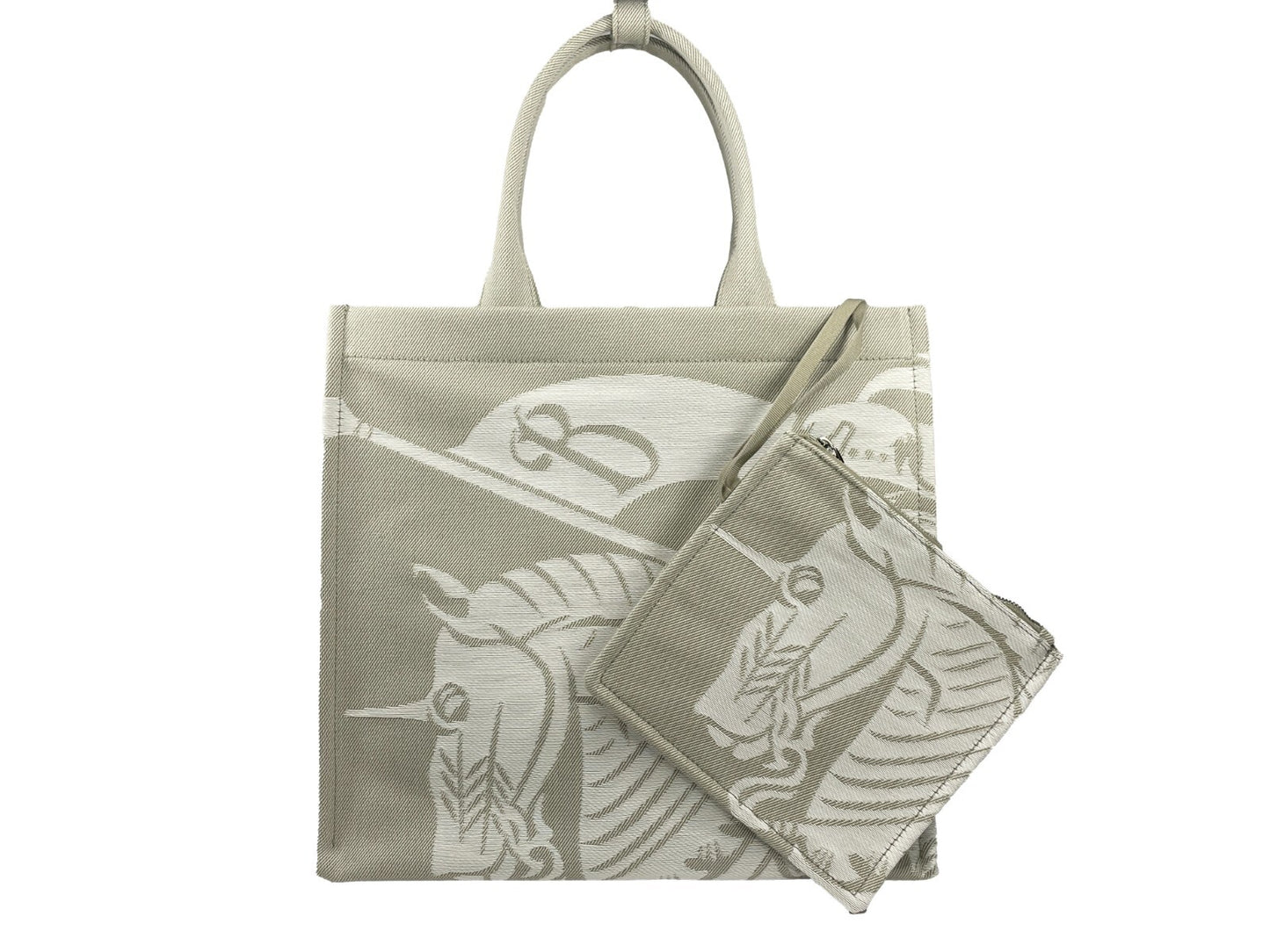 This Travel Pouch Tote Handbag by Burberry for women in calfskin leather & nylon and silver & patterned presents a sculptural silhouette featuring a secure , ample coin-purse, and versatile handle for a sculptural finish.