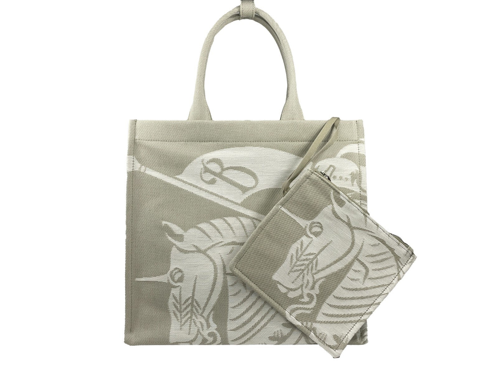 This Travel Pouch Tote Handbag by Burberry for women in calfskin leather & nylon and silver & patterned presents a sculptural silhouette featuring a secure , ample coin-purse, and versatile handle for a sculptural finish.