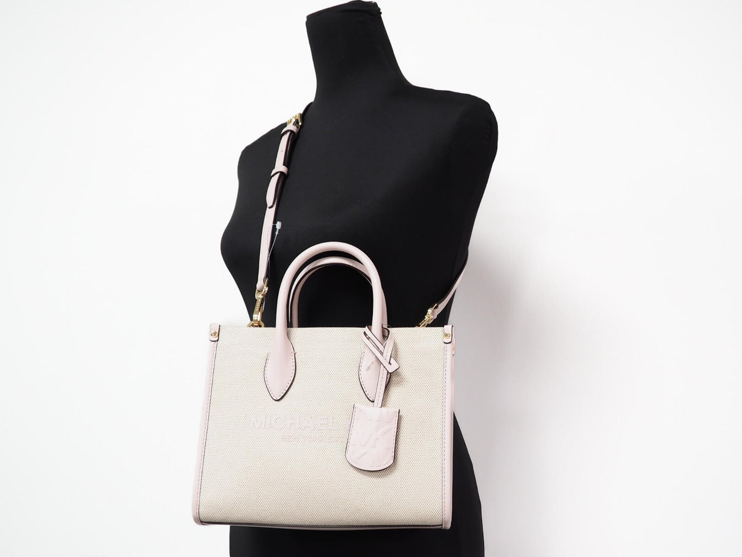 Small Crossbody Evening Shopper Handbag by Michael Kors for women in canvas beige & gold features a refined silhouette, showcasing a secure zipper, organized , and versatile crossbody-strap, adjustable-strap & detachable-strap for a refined finish.