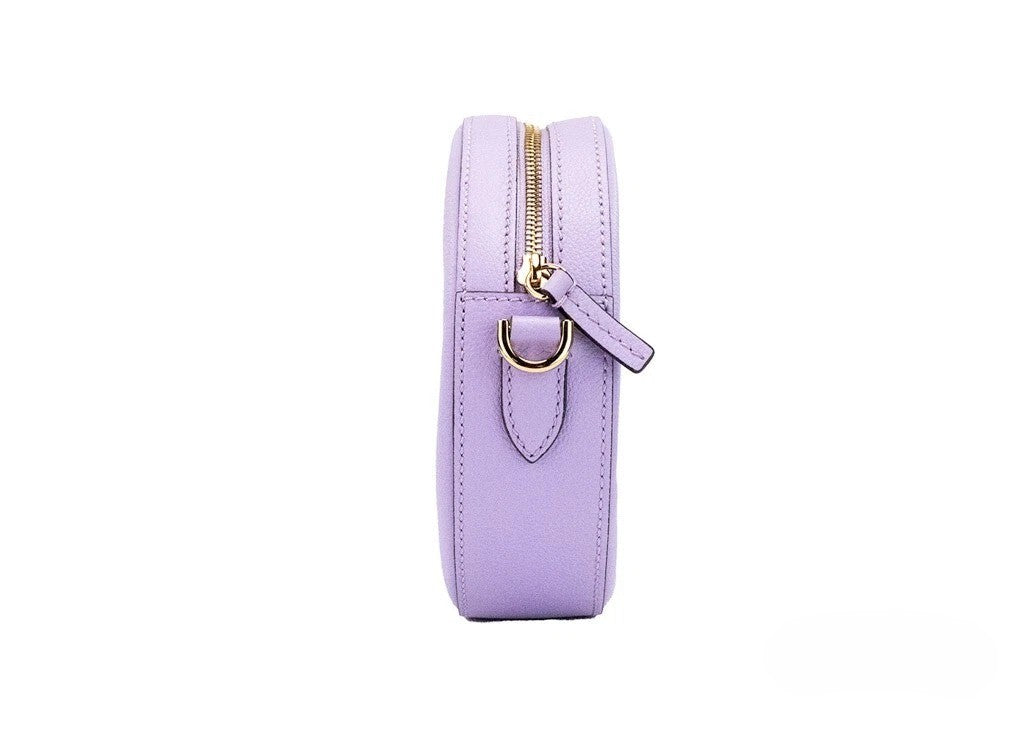 Small Travel Crossbody Camera Handbag by Versace for women in faux leather & canvas gold, lilac & purple features a multifaceted silhouette, showcasing a secure zipper and multifaceted cardholder with versatile crossbody-strap, adjustable-strap & detachable-strap for multifaceted style.