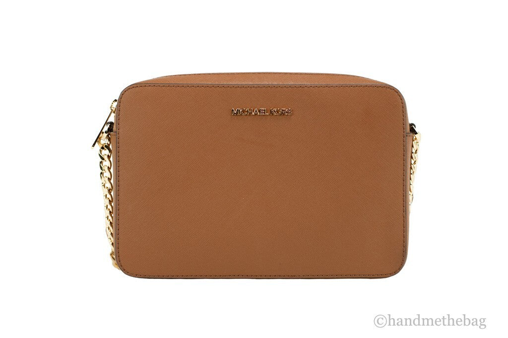 Crossbody Handbag by Michael Kors for women in leather & rubber brown, gold & signature features a multifaceted silhouette, showcasing a secure zipper and multifaceted with versatile crossbody-strap & adjustable-strap for multifaceted style.