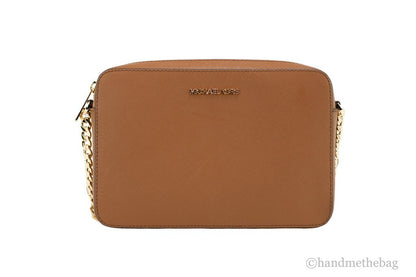 Crossbody Handbag by Michael Kors for women in leather & rubber brown, gold & signature features a multifaceted silhouette, showcasing a secure zipper and multifaceted with versatile crossbody-strap & adjustable-strap for multifaceted style.