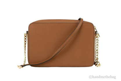 Crossbody Handbag by Michael Kors for women in leather & rubber brown, gold & signature features a versatile chic silhouette, meticulously detailed with a secure zipper, ample , and versatile crossbody-strap & adjustable-strap.