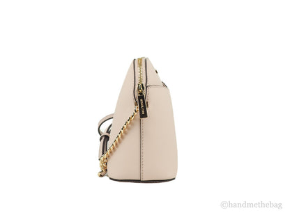 Compact Crossbody Dome Handbag by Michael Kors for women in leather & satin beige, gold & pink features a versatile chic silhouette, meticulously detailed with a secure , ample , and versatile crossbody-strap & adjustable-strap.