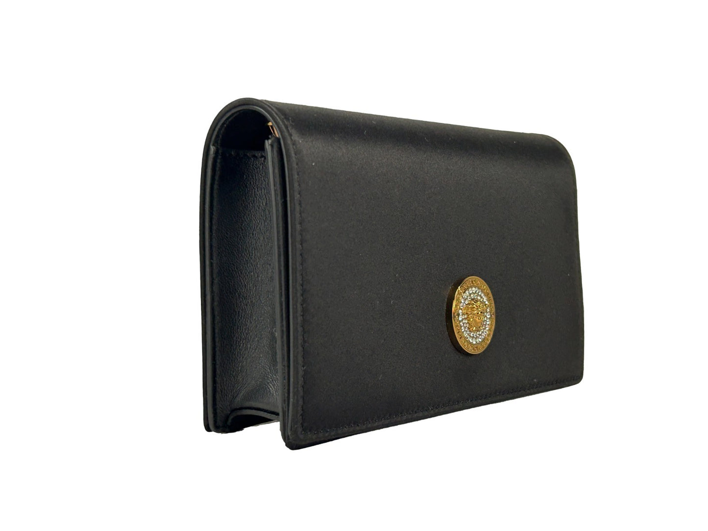 Mini Crossbody Handbag by Versace for women in leather black & gold features a versatile chic silhouette, meticulously detailed with a secure snap & button, ample cardholder, and versatile crossbody-strap.