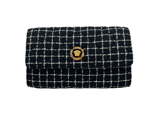Crossbody Handbag by Versace for women in leather black & gold features a multifaceted silhouette, showcasing a secure snap & button and multifaceted cardholder with versatile crossbody-strap for multifaceted style.