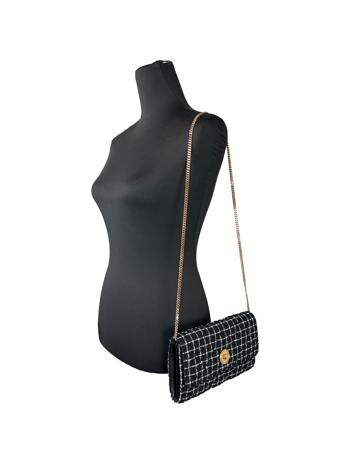 Crossbody Handbag by Versace for women in leather black & gold features a multifaceted silhouette, showcasing a secure snap & button and multifaceted cardholder with versatile crossbody-strap for multifaceted style.