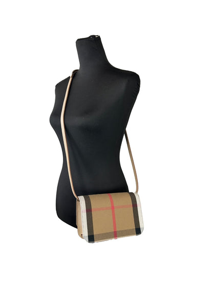Small Crossbody Handbag by Burberry for women in canvas beige & gold features a transformative elegance silhouette, showcasing a secure , organized , and versatile crossbody-strap & adjustable-strap for a transformative elegance look.