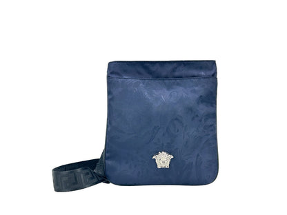Crossbody Handbag by Versace for women in calfskin leather & nylon navy & silver features an multi-faceted design with a secure , ample , and versatile crossbody-strap & adjustable-strap for a multi-faceted finish.