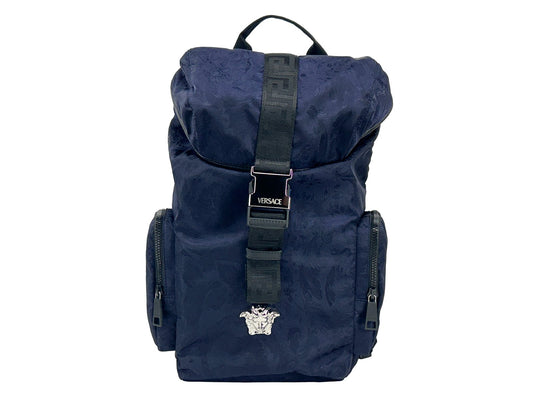 Drawstring Flap Backpack by Versace for women in nylon navy & silver features a refined silhouette, showcasing the Medusa Nylon Drawstring Flap Backpack design with a secure flap, drawstring & buckle, ample , and versatile handle, backpack-strap & adjustable-strap.