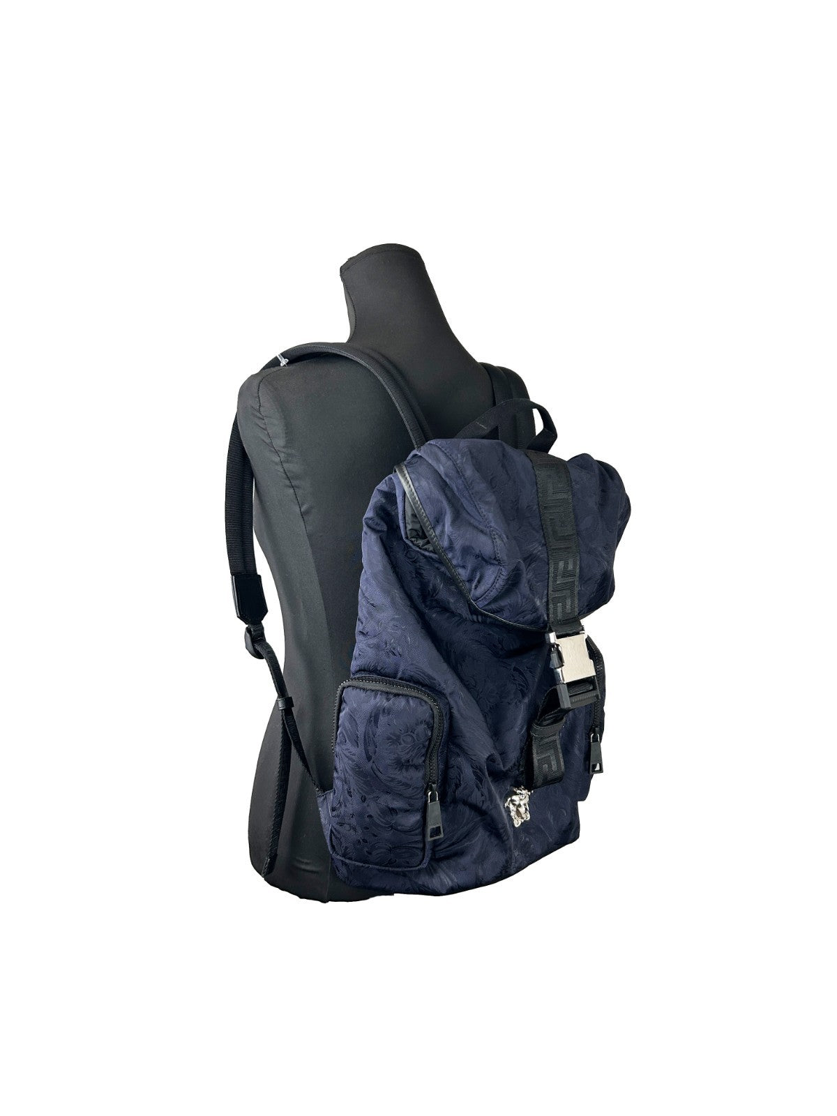Drawstring Flap Backpack by Versace for women in nylon navy & silver showcases an architectural Medusa Nylon Drawstring Flap Backpack design, featuring a secure flap, drawstring & buckle, ample , and architectural handle, backpack-strap & adjustable-strap for a sophisticated look.