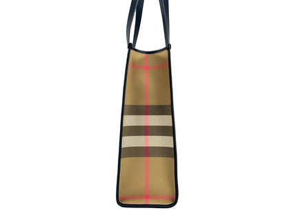 Medium Tote Bag by Burberry for women in canvas silver & print features an jet-set-ready silhouette, showcasing the Canvas Medium Tote Bag design with a secure snap & button, ample , and versatile .