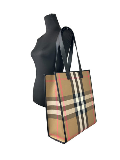 Medium Tote Bag by Burberry for women in canvas silver & print features an jet-setting Canvas Medium Tote Bag design with a secure snap & button, jet-setting , and versatile for a jet-setting look.