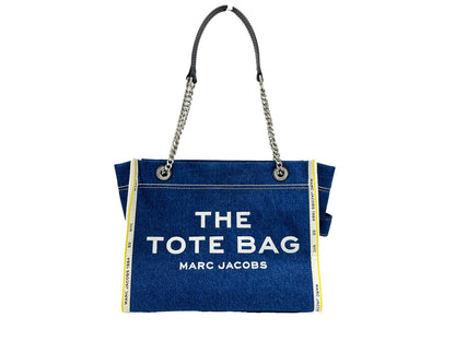 Medium Tote Bag by Marc Jacobs for women in stretch denim & viscose silver features an jet-setting The Tote Stretch Denim & Viscose Medium Bag design with a secure zipper, jet-setting , and versatile for a jet-setting look.