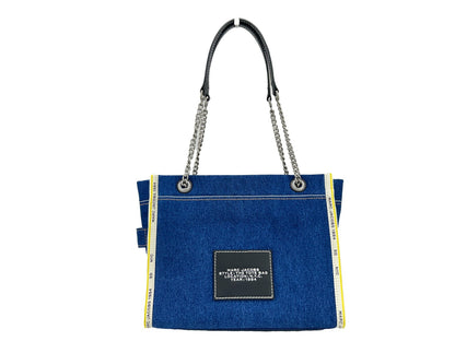 Medium Tote Bag by Marc Jacobs for women in stretch denim & viscose silver features a jet-set The Tote Stretch Denim & Viscose Medium Bag design, complete with a secure zipper, ample , and versatile for a jet-set look.