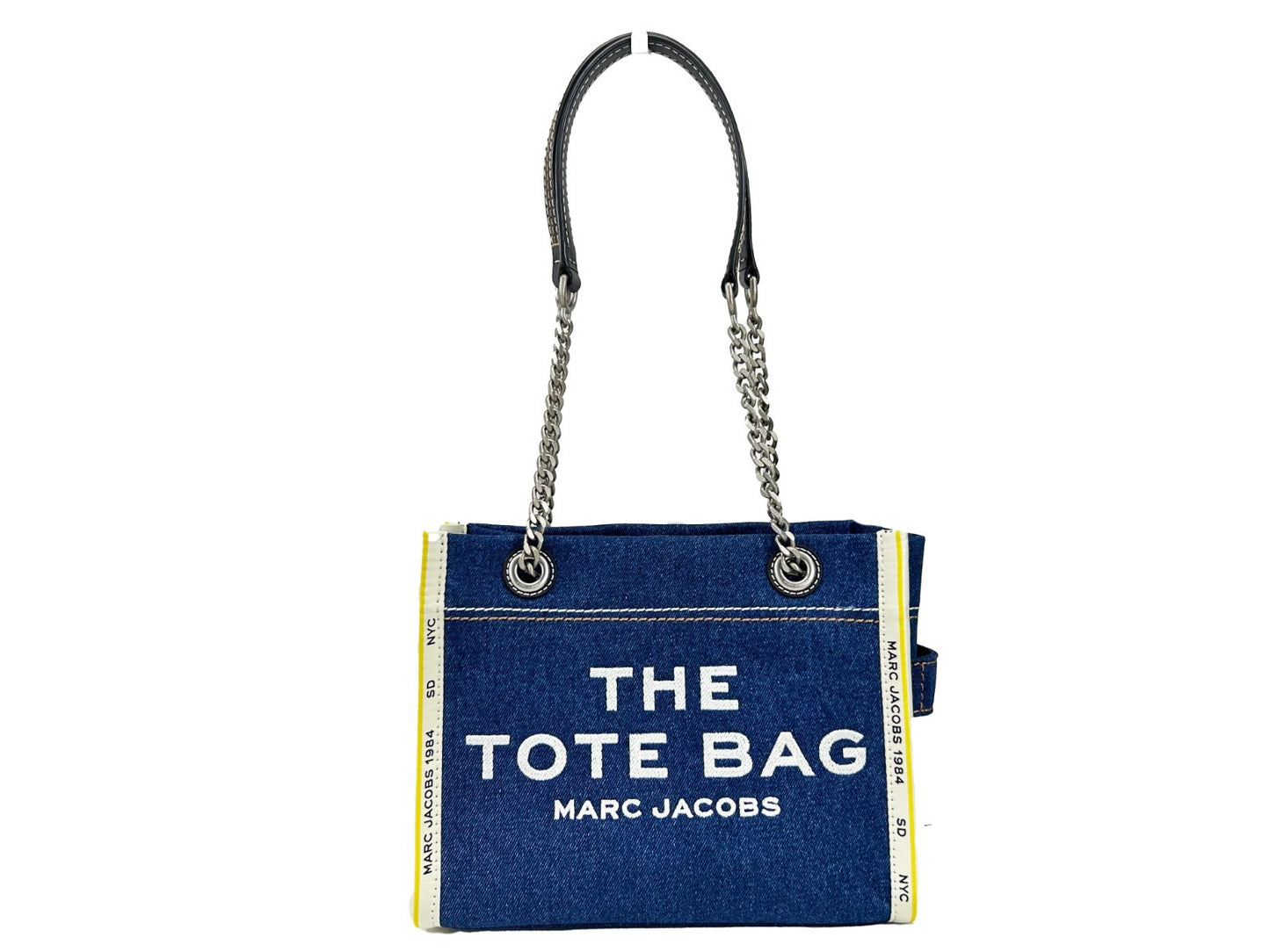 Tote Bag by Marc Jacobs for women in stretch denim & viscose silver showcases a statuesque The Tote Stretch Denim & Viscose Bag design, featuring a secure zipper, ample , and versatile for a statuesque finish.