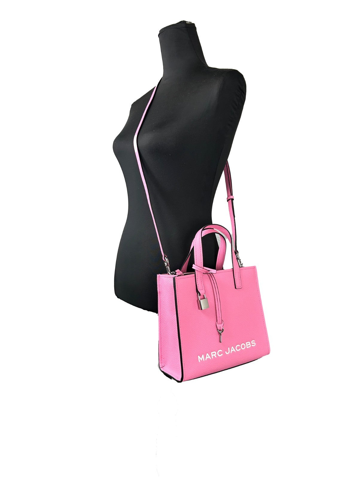 Mini Crossbody Tote Bag by Marc Jacobs for women in faux patent leather pink & silver features an jet-setting Mini Grind Faux Patent Leather Crossbody Tote Bag design with a secure zipper, jet-setting , and versatile crossbody-strap, adjustable-strap & detachable-strap for a jet-setting look.