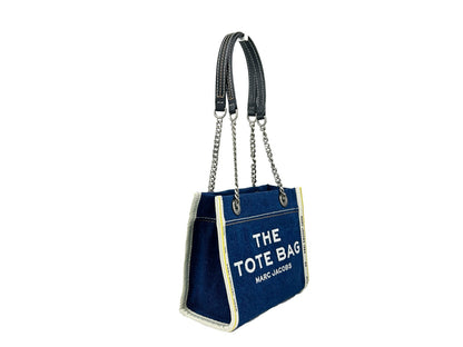 This Tote Bag by Marc Jacobs for women in stretch denim & viscose silver features an jet-set The Tote Stretch Denim & Viscose Bag design with a secure zipper, ample , and jet-set .