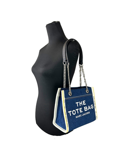 Tote Bag by Marc Jacobs for women in stretch denim & viscose silver features a jet-set sophisticated The Tote Stretch Denim & Viscose Bag design with a secure zipper, ample , and versatile for a jet-set sophisticated finish.