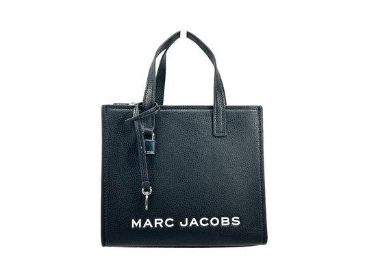 Mini Crossbody Tote Handbag by Marc Jacobs for women in faux patent leather black & silver features a versatile chic silhouette, meticulously detailed with a secure zipper, ample , and versatile crossbody-strap, adjustable-strap & detachable-strap.