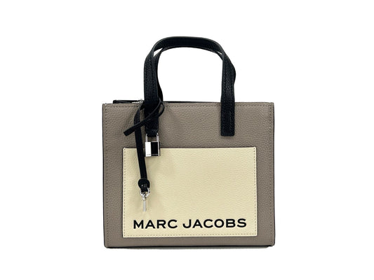 Mini Crossbody Tote Bag by Marc Jacobs for women in faux patent leather silver features a jet-set Faux Patent Leather Mini Crossbody Tote Bag design, complete with a secure zipper, ample , and versatile crossbody-strap, adjustable-strap & detachable-strap for a jet-set look.